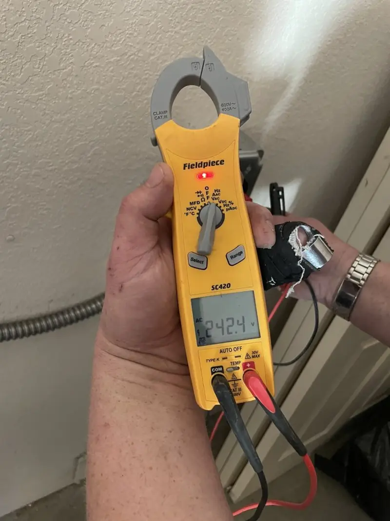 Voltage testing with clamp meter during Whole House Surge Protector in Edgartown
